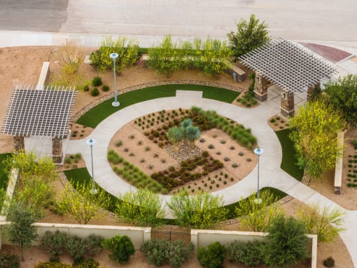 an aerial view of a garden in a parking lot