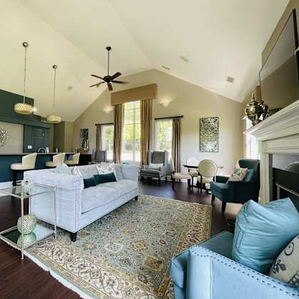 a large living room with a couch and a table at The Chase, Burlington, NC