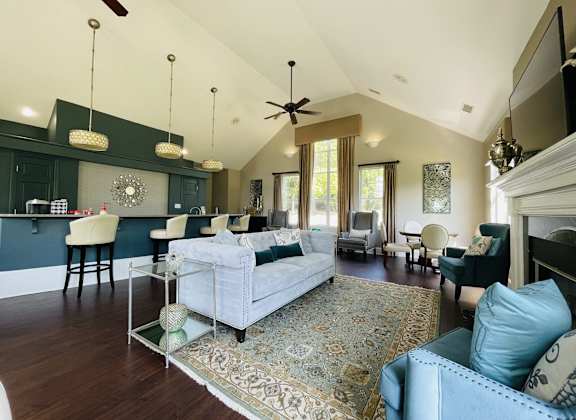 a large living room with a couch and a table at The Chase, Burlington, NC