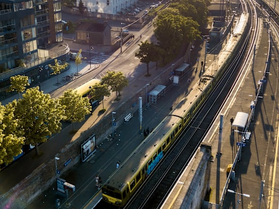 a train on the tracks in an empty city