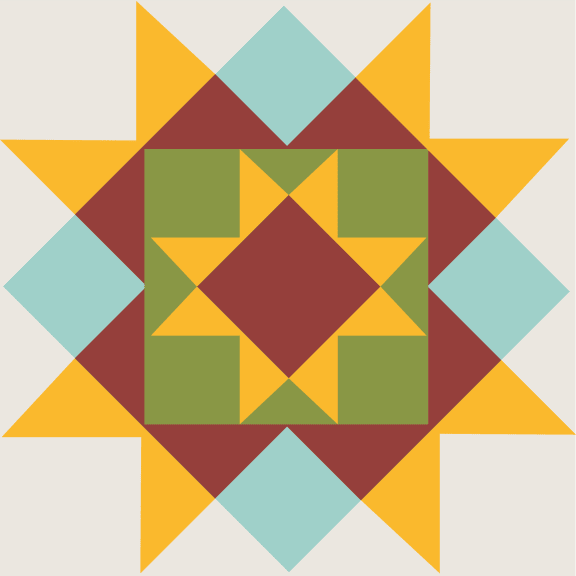 a patchwork quilt with a yellow and green star in the center