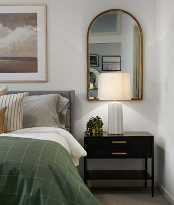 A bedroom with a bed at The Flats at West End Apartments, St. Louis Park, MN 55416