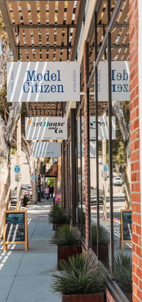a street view of a building with signs on the side of it