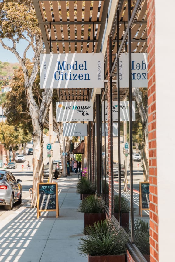 a street view of a building with signs on the side of it