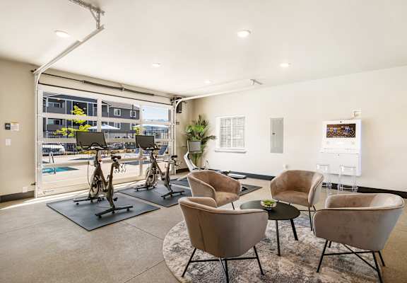 a resident fitness center with exercise machines and chairs at Altitude, East Wenatchee, WA, 98802