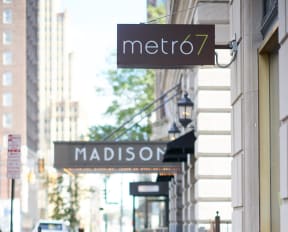 a sign for madison street in front of a store