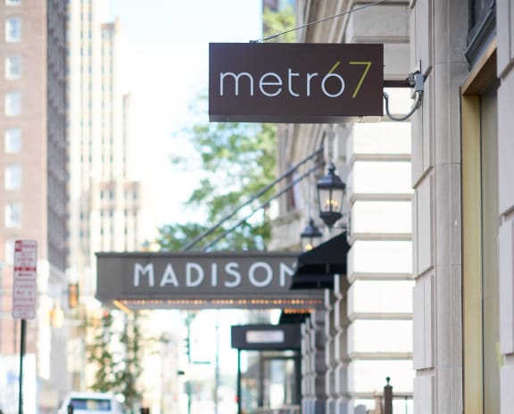 a sign for madison street in front of a store at Metro67, Memphis, 38103