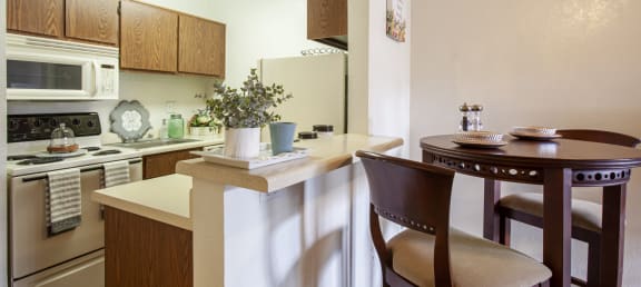 Casa Bella Apartments in Tucson, Arizona Model Kitchen and Dining Area
