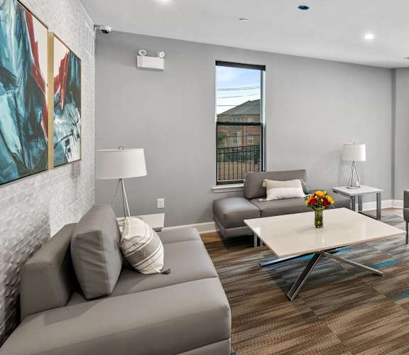 a living room with couches and chairs and a table