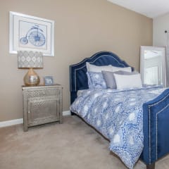 a bedroom with a bed and a window at Carrington Place at Wildewood, Columbia, SC