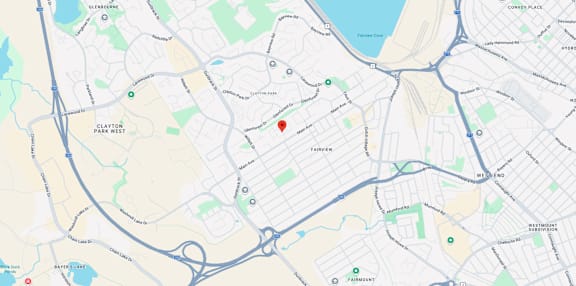 A map shows a red marker at the center of a parking lot, with various other locations and roads labeled around it.