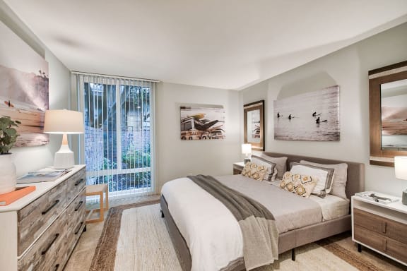 a bedroom with a bed and a window at The Meadows Apartments, Culver City , CA 90230