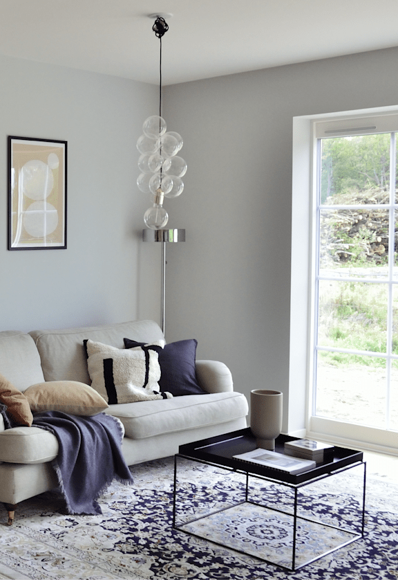 a small living room with a couch and a coffee table