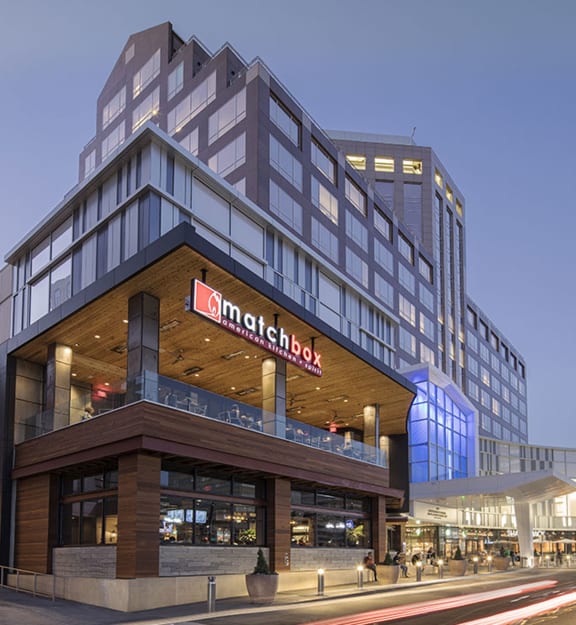 a rendering of a large hotel with a sign on the side of it