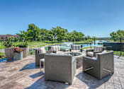 Thumbnail 10 of 53 - community fire pit with seating  at Waterside Residences on Quivira, Kansas
