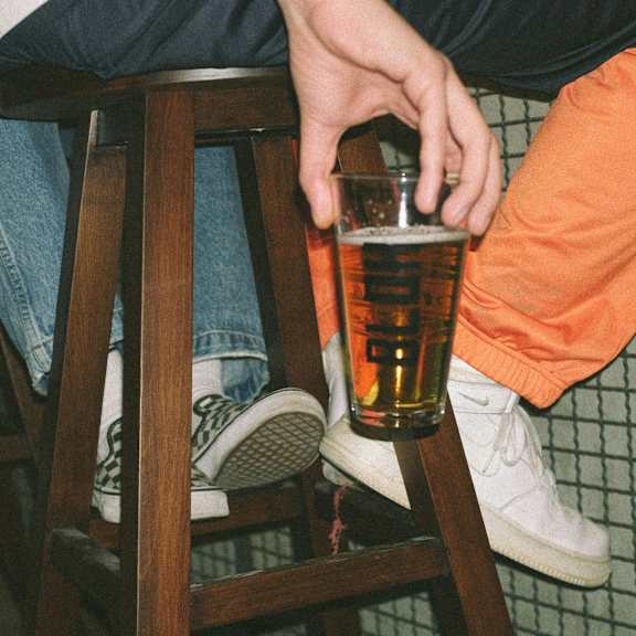 Close-up of a craft beer being served at a local brewery.
