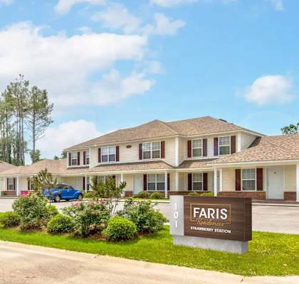 A FARIS sign is in front of a building.