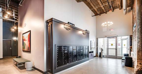 a large room with a large wall of wine bottles in it