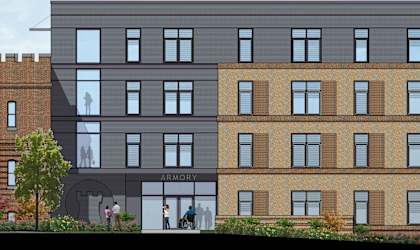 A rendering of a modern building with a brick facade and a storefront labeled Armory.
