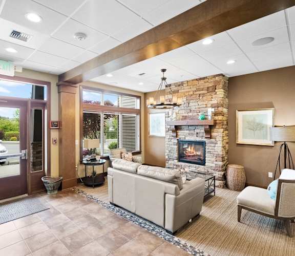 a living room with a couch and a fireplace