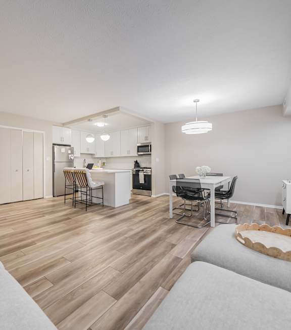 the living room and dining room of an apartment at Huntington Green Apartments, University Heights, OH