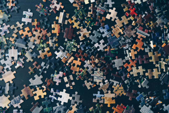 puzzle_pieces_navy_blue_background at Sumida Gardens Apartments, Santa Barbara, CA