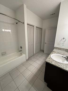 a bathroom with a sink and a bath tub