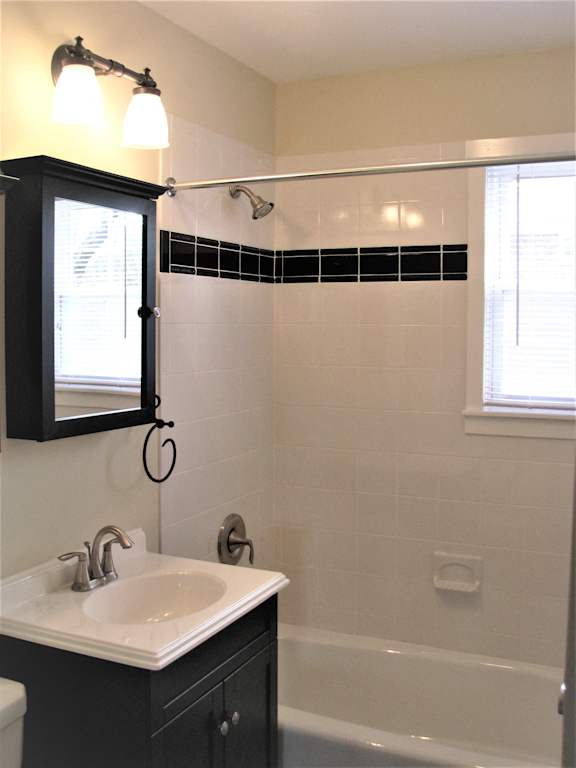 Bath tub area with sink and vanity at Rivercrest Apartments, New Jersey, 08854