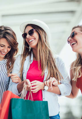 three women walking down the street with shopping bags at Gateway Club, Boynton Beach, FL, 33436