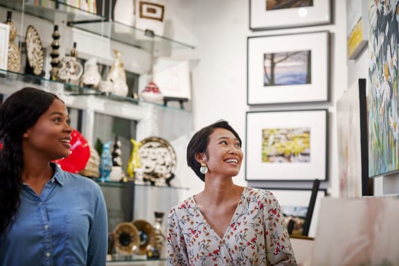 Two women exploring the Gallery at Grandover