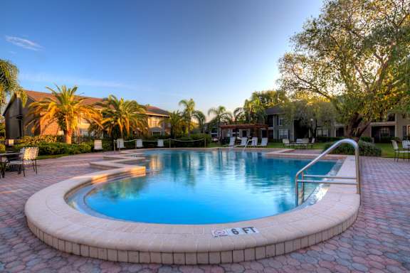 This is one of our three pools, with beautiful paver deck surrounded by lush landscaping.