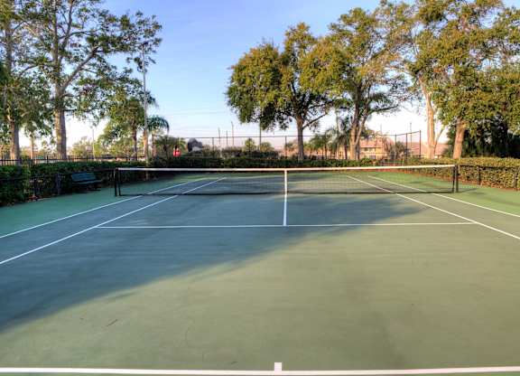 Two, hedge lined tennis courts offer a sweet spot for a game.
