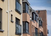 Thumbnail 2 of 2 - a row of apartment buildings with large windows and balconies