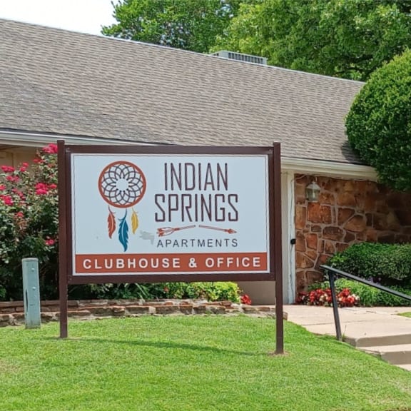 a building with a sign that says indian springs apartments