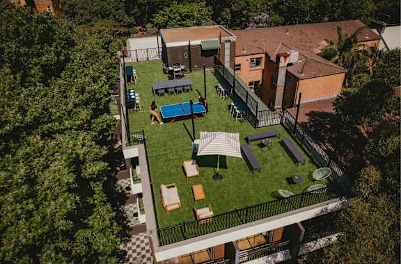 a birdseye view of the backyard of a house with a lawn