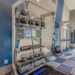 Gym with kettlebells, med balls, rope and punching bag 