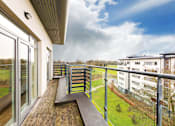 Thumbnail 3 of 5 - a balcony with a view of a yard and some buildings