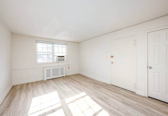 A room with a window and a door.