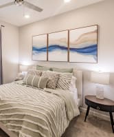 a bedroom with a bed and a ceiling fan at swiftwater apartments in port charlotte
