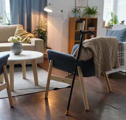 A living room with a sofa, two chairs, and a coffee table.