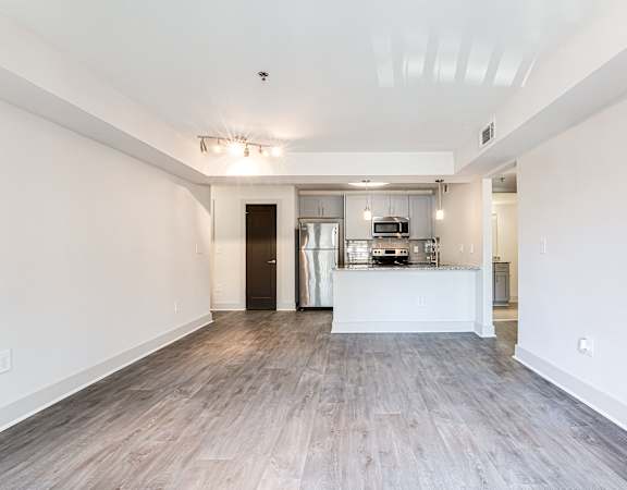 Living room with open kitchen at The Metro Apartments, Atlanta, GA