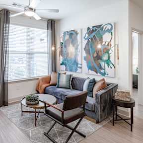 Living room with White Couch at The Glover House Apartments, Washington, DC, 20007