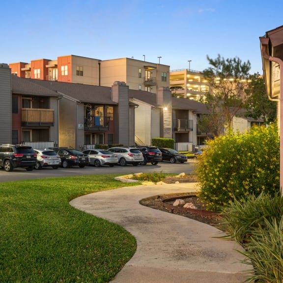 a view of a building with cars parked in a parking lot at South Lamar Village, Austin, 78704