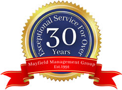 A gold and blue seal with a red ribbon that says Exceptional Service for over 30 years.
