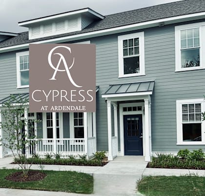 A row of houses with a sign that says Cypress at Ardendale.