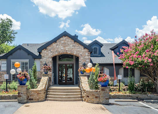 the front entrance of the clubhouse at the preserve at gardner park apartments at District 2308, Arlington, TX ?