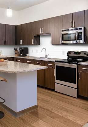 a kitchen and dining area in a 555 waverly unit at The Rialto, Orlando, 32819