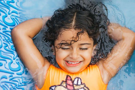 child enjoying a day at the pool at Fairmont at South Lake, Maryland