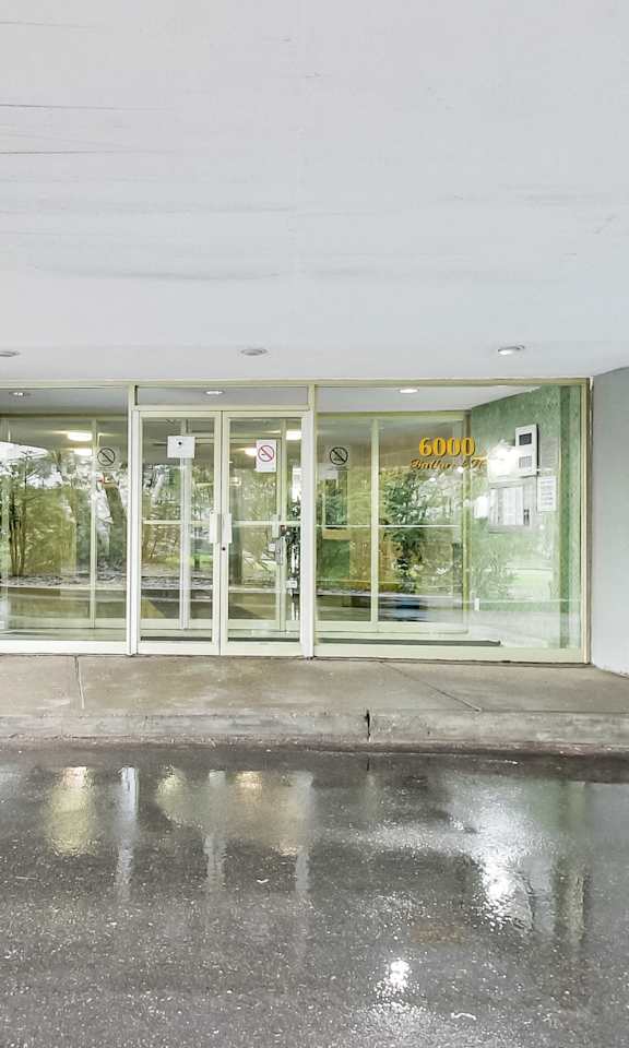 the entrance of a building with glass doors