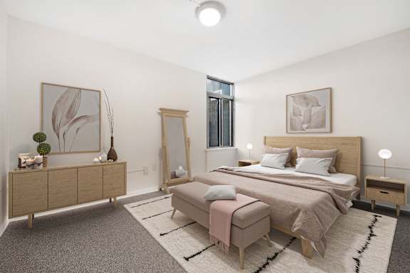 a bedroom with a bed and dresser in a 555 waverly unit at Shoreline Apartments, Buffalo, New York